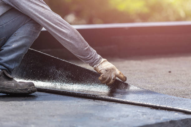 Professional Basement Waterproofing technician working in Perry, KS